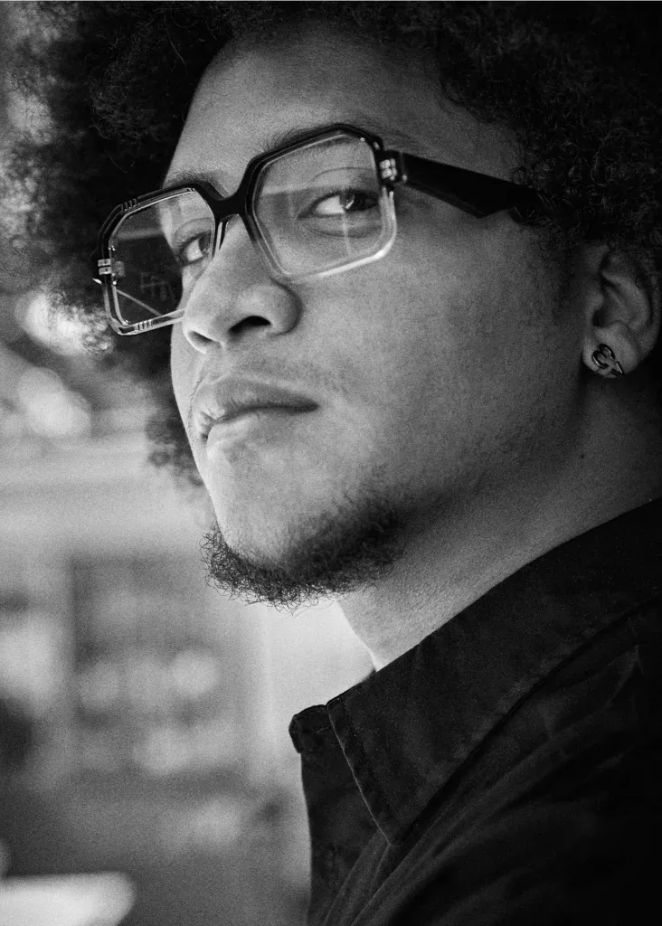 Black and white profile of a man in black and clear Ffin BOD optical frames