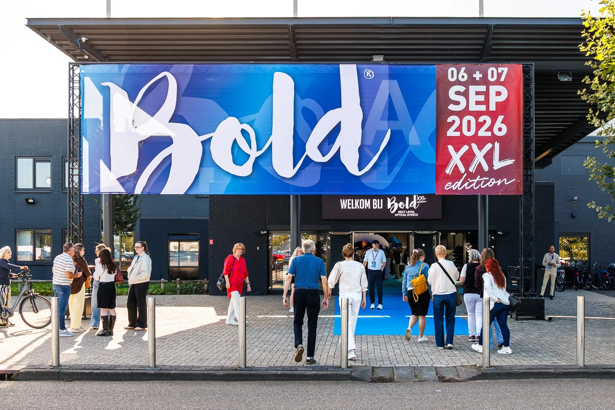 Visitors entering the Bold XXL optical fair beneath the event banner