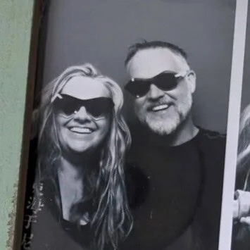 Anna and Niall in sunglasses in a black and white photo-booth portrait marking the Ffin partnership