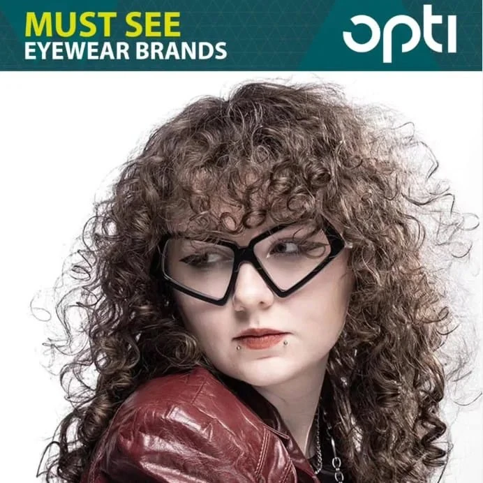 OPTI Munich "Must see eyewear brands" advert: model with curly hair in black angular Ffin optical frames