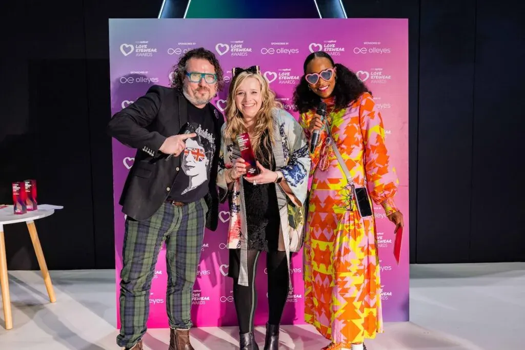Ffin Eyewear team holding trophies at the Love Eyewear Awards, celebrating two wins at 100% Optical