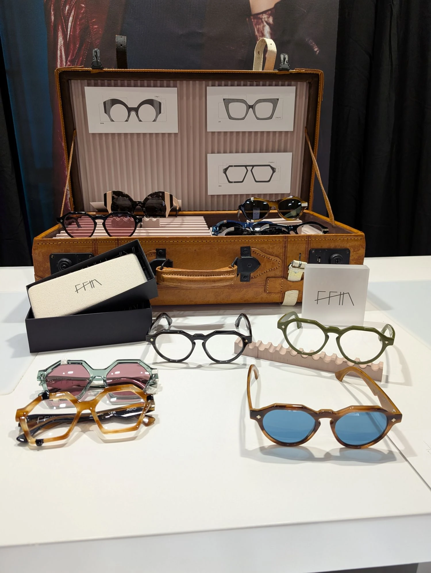 Vintage suitcase display of Ffin sunglasses and optical frames on the Bold XXL stand