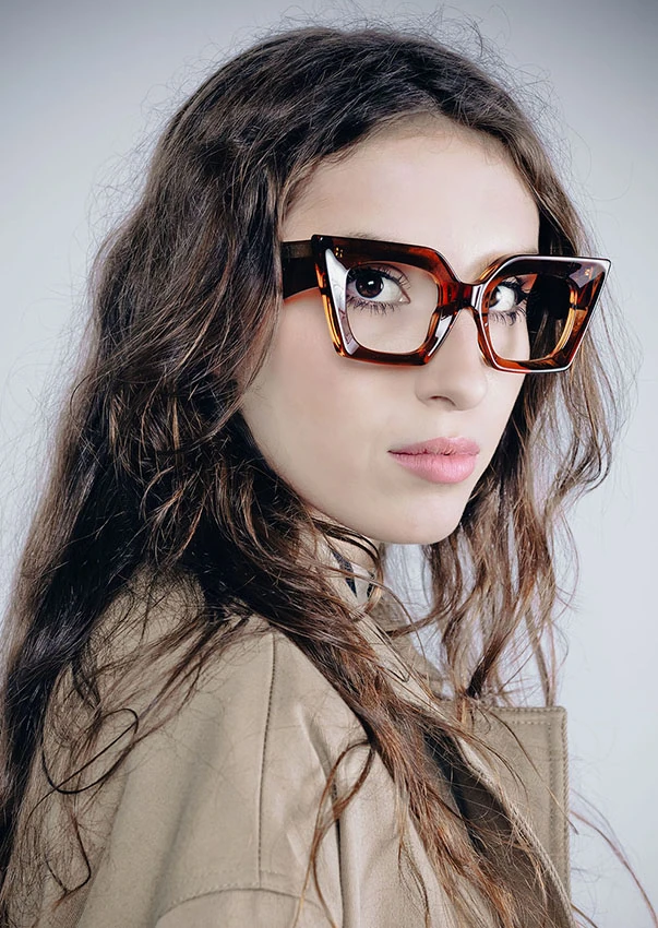 Woman with wavy hair in tortoiseshell Ffin IFF optical frames with squared cat-eye corners