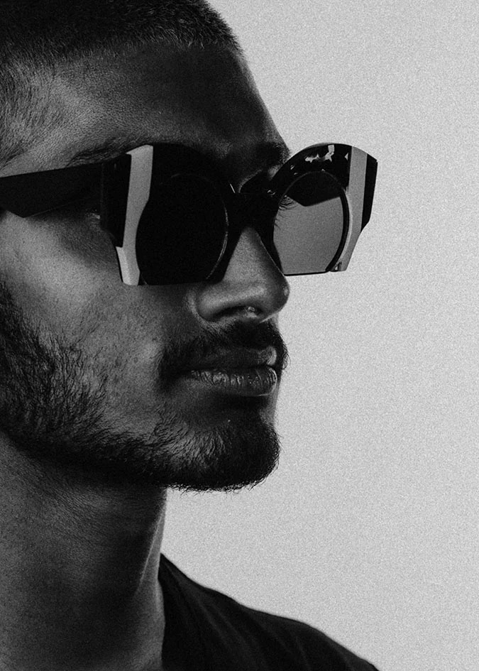 Black and white profile of a man in bold black and white Ffin ORA designer sunglasses