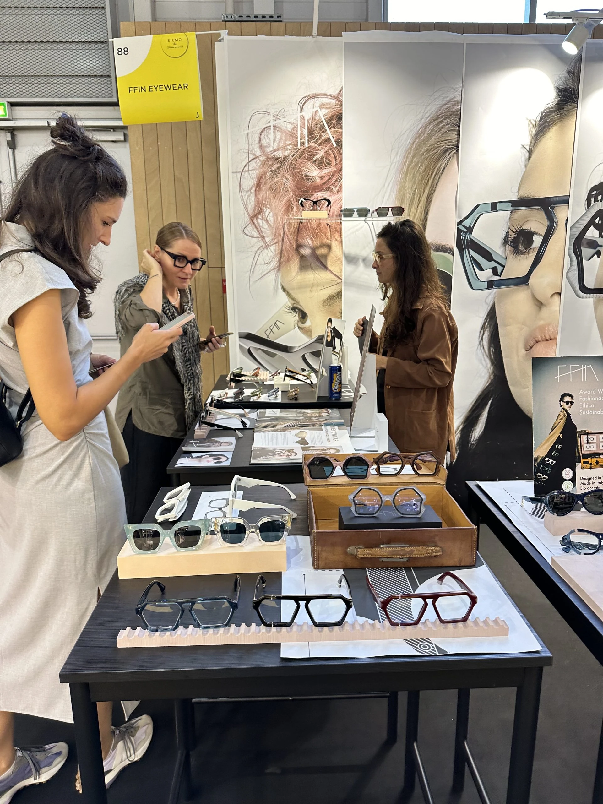 Visitors browsing the Ffin stand at SILMO Paris