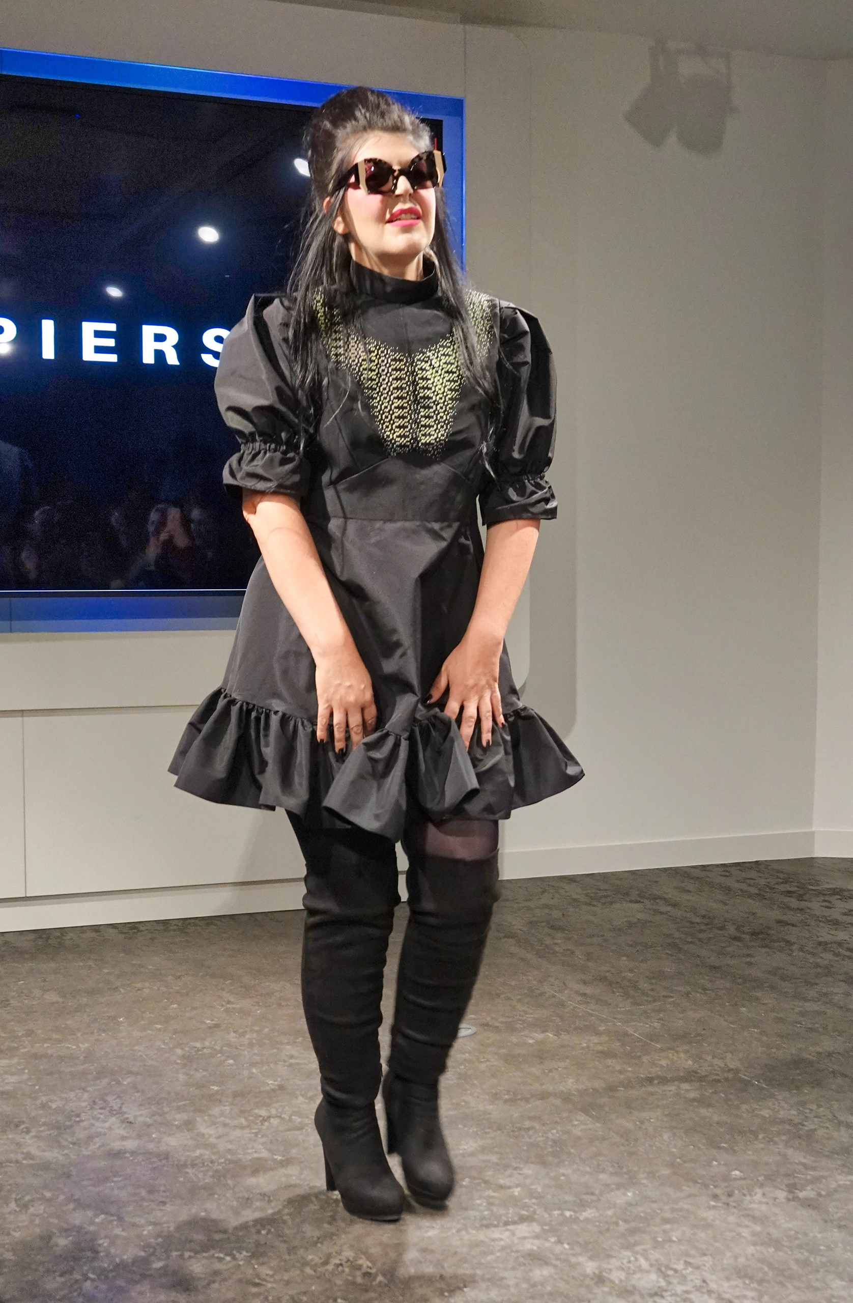 Siouxsie Sioux on the Jayne Pierson catwalk in Ffin ORA designer sunglasses and a black ruffled dress