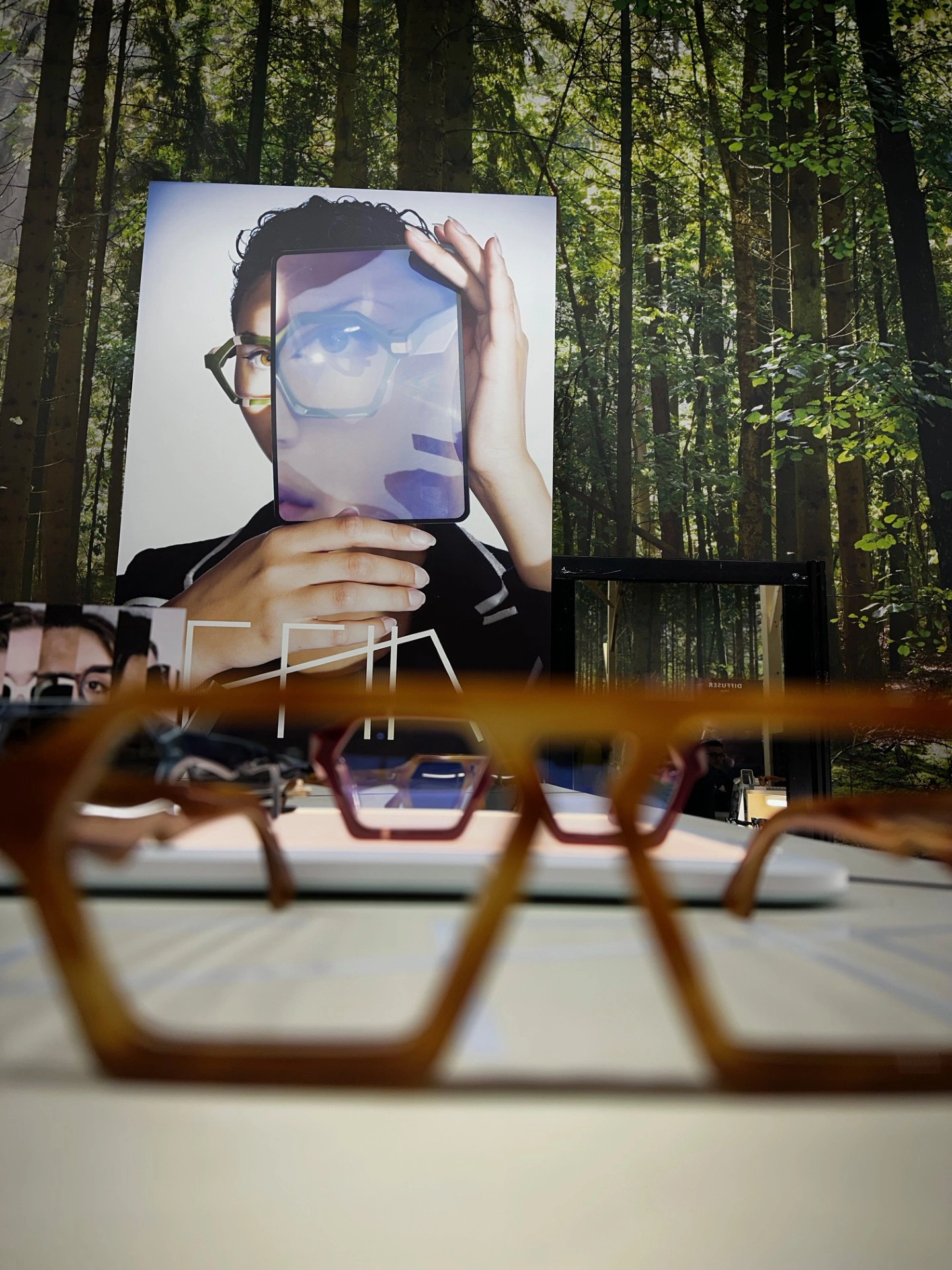 Hexagonal amber Ffin ADO optical frames on display at the Ffin stand at MIDO